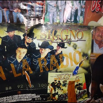 El Cochinito Contento - The ambiance of the dining room is enhanced by hundreds of posters on the wall of Mexican music groups, which seems to fit in quite well. - Mexican Near Me - Fresno, California