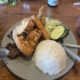 Pork chop egg roll and chicken wing over rice