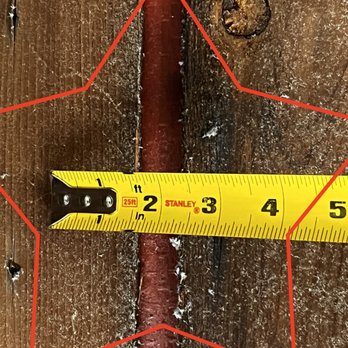 Excel Exteriors - 1" Gap in existing decking, so plywood should have been installed.  It wasn't.  The pink/red water barrier is showing in the gap. - Roofing Near Me - Clearwater, Florida