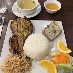 Pork chop, pork cake on steamed rice.