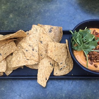 Vital Root - zoomed out view of the Cashew "Queso" Dip n crunchy whole grain chips (I ate a couple but would sub veg next time) - Vegetarian Near Me - Denver, Colorado Vital Root - zoomed out view of the Cashew "Queso" Dip n crunchy whole grain chips (I ate a couple but would sub veg next time) - Vegetarian Near Me - Denver, Colorado