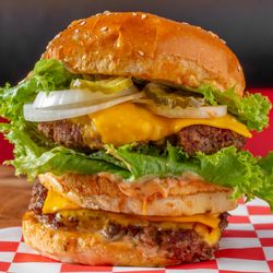 Burgers At Manassas - The Apollo burger comes with two Angus beef patties, American cheese, lettuce, onions, pickles and Burgers@ sauce on a sesame seed bun.