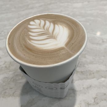 Amilles Coffee - a cup of cappuccino on a marble table - Coffee & Tea Near Me - Houston, Texas Amilles Coffee - a cup of cappuccino on a marble table - Coffee & Tea Near Me - Houston, Texas