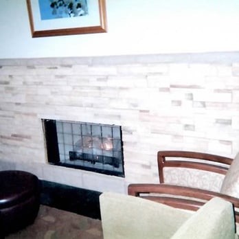 Byerly Masonry - a living room with a fireplace - General Contractors Near Me - Columbus, Ohio