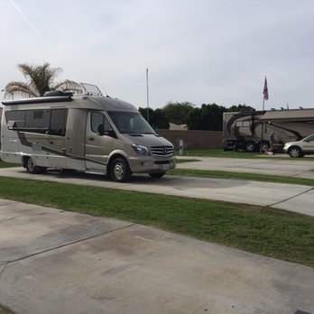 BlissRV - Serenity at a grassy spot in an RV resort. Fit right in with the fancy pants rigs! - RV Rental Near Me BlissRV - Serenity at a grassy spot in an RV resort. Fit right in with the fancy pants rigs! - RV Rental Near Me