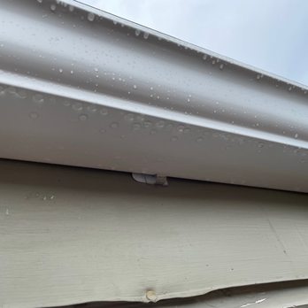 Weather Tight - Gutter instal over 3M plastic light hangers - Roofing Near Me - West Allis, Wisconsin Weather Tight - Gutter instal over 3M plastic light hangers - Roofing Near Me - West Allis, Wisconsin