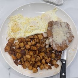 Fried steak and eggs with white gravy