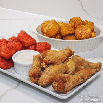 Wingstop - a plate of chicken wings and dipping sauce - Chicken Wings Near Me - Downers Grove, Illinois