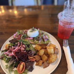Greenhouse Cafe - Cilantro Avocado Toast with a poached egg and hibiscus iced tea