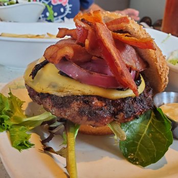 The Counter - Upclose. Medium 1/2lb beef, multigrain bun, smoked gouda, garlic aioli, tomato, mixed greens, grilled red onion, and bacon. - Burgers Near Me - Honolulu, Hawaii The Counter - Upclose. Medium 1/2lb beef, multigrain bun, smoked gouda, garlic aioli, tomato, mixed greens, grilled red onion, and bacon. - Burgers Near Me - Honolulu, Hawaii