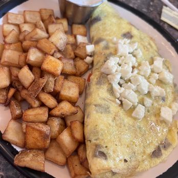Whisk & Grind - House omelet (gyro, tomato, onion, feta) and seasoned potatoes - Breakfast & Brunch Near Me - Merritt Island, Florida Whisk & Grind - House omelet (gyro, tomato, onion, feta) and seasoned potatoes - Breakfast & Brunch Near Me - Merritt Island, Florida