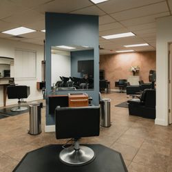 Vanity Avenue Salon - Stylist's stations with a sneak peak of our esthetician's room