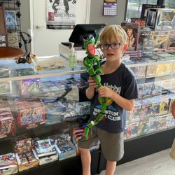 Uncanny Comics and Games - Available TCG games: Magic the Gathering, Yu-Gi-Oh!, Pokémon, Digimon, Dragon Ball Z, and Meta Zoo
