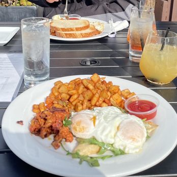 The Rooftop Lounge - Sunrise Egg Sandwich & 2 Egg Breakfast (further back)  White wine sangria & spritz - Lounges Near Me - Laguna Beach, California