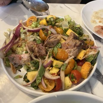 Pomelo Thai Boutique Restaurant - Mangos were unripe, pork was tough and fatty. Served on shredded lettuce. - Thai Near Me - New Orleans, Louisiana Pomelo Thai Boutique Restaurant - Mangos were unripe, pork was tough and fatty. Served on shredded lettuce. - Thai Near Me - New Orleans, Louisiana