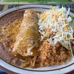 Taco King - Chicken enchilada and chicken taco combo plate side of refried beans and Mexican rice