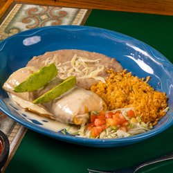 Hacienda Guadalajara Cheyenne - A plate of Mexican cuisine served on a blue dish in a casual restaurant setting.