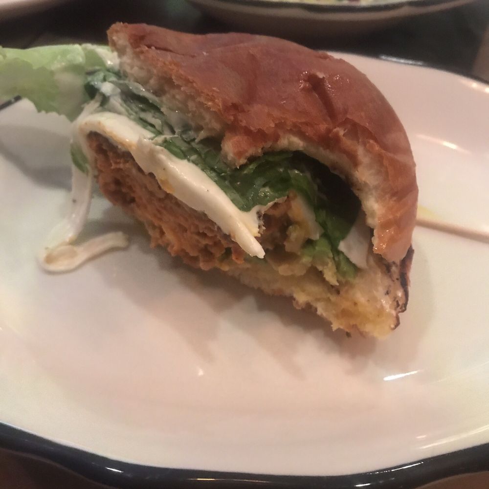 The Whitlock - Half of the chorizo and shrimp burger with a bite in it - Bars Near Me - Katonah, New York The Whitlock - Half of the chorizo and shrimp burger with a bite in it - Bars Near Me - Katonah, New York