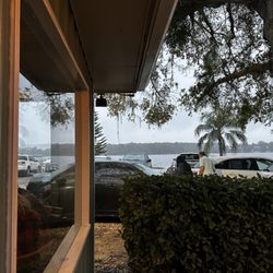 Harry's Old Place - Outdoor dining and a section of restaurant has view of lake.