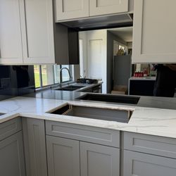 Precision Windows and Glass - Grey mirror backsplash