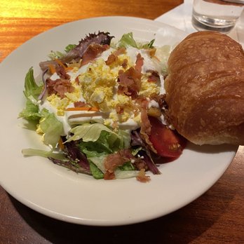 Charleston's - Dinner salad with an incredibly delicious croissant drizzled with honey! - American Near Me - Fort Worth, Texas
