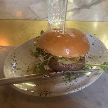 Manuela - Venison Burger, Pickled Green Tomato, Arugula, Crisp Leeks, Garlic Aioli, Brioche Bun - New American Near Me - Los Angeles, California Manuela - Venison Burger, Pickled Green Tomato, Arugula, Crisp Leeks, Garlic Aioli, Brioche Bun - New American Near Me - Los Angeles, California