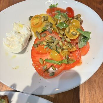Chroma - Sliced tomatoes with burrata - American Near Me - Houston, Texas Chroma - Sliced tomatoes with burrata - American Near Me - Houston, Texas