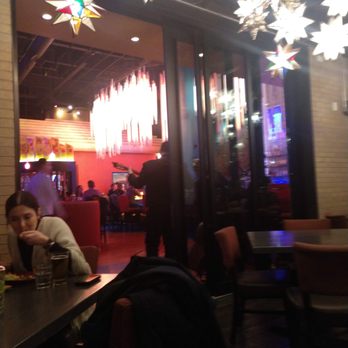 Que Bueno Suerte! - Our view into the beautiful dining room that held empty booths, and that had a view of the band that is not the backs of their heads. - Mexican Near Me - Denver, Colorado