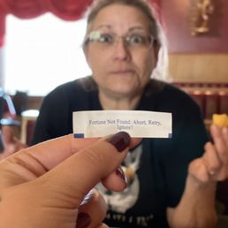 a woman holding a piece of paper a woman holding a piece of paper