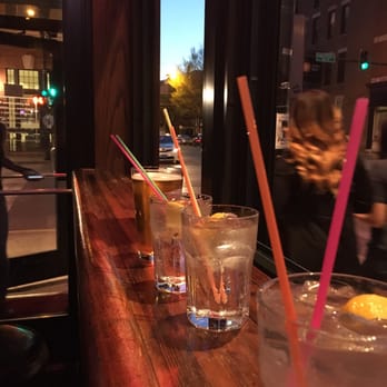 Marquee Lounge - a row of glasses with drinks on a bar - Lounges Near Me - Chicago, Illinois