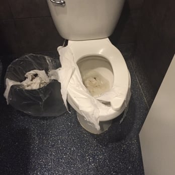 Captain James Landing - What one of the stalls looked like. The inside of the toilet was also stuffed full of papers well. - Seafood Near Me - Baltimore, Maryland