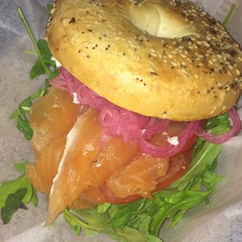 The Junction Kitchen - House Cured Salmon Bagel with goat cheese, red onions, arugula - Breakfast & Brunch Near Me - North Charleston, South Carolina The Junction Kitchen - House Cured Salmon Bagel with goat cheese, red onions, arugula - Breakfast & Brunch Near Me - North Charleston, South Carolina