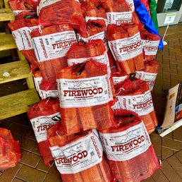 a pile of firewood logs