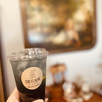 The Classic Cafe - a hand holding a cup of coffee - Coffee & Tea Near Me - Fullerton, California