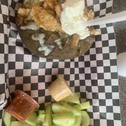 La Esquina - Baked potato with butter, chicken (delish), cheese and sour cream. Although, you can have anything you want on it.
