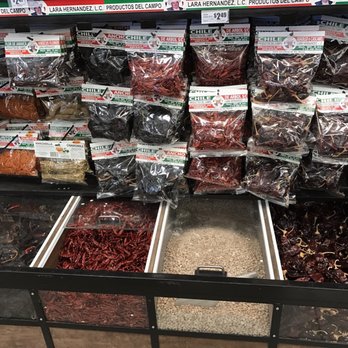 H-E-B - ows a variety of spices in a grocery store - Gas Stations Near Me - Pflugerville, Texas