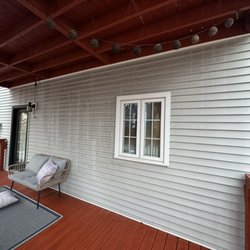 Resurgence Pressure Washing - Siding before treatment and pressure washing
