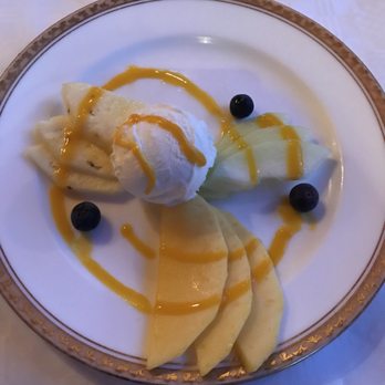 Srikandi - Dessert that came with our meal. Vanilla ice cream and fresh fruit with mango puree sauce on top. - Indonesian Near Me - Amsterdam, New Hampshire
