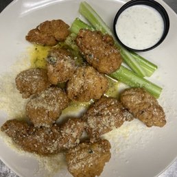 garlic parmesan boneless wings with ranch and celery.