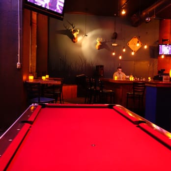 Camp Bar - a pool table with a red cloth - Bars Near Me - Saint Paul, Minnesota