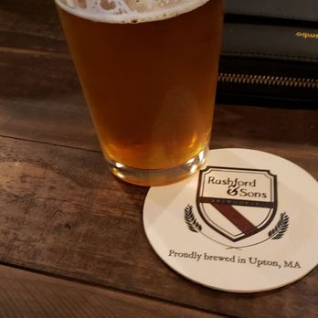 Rushford & Sons Brewhouse - a glass of beer on a table - Breweries Near Me - Upton, Massachusetts