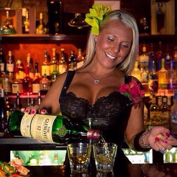 The Penthouse Club - a woman pouring a drink - Strip Clubs Near Me - Baltimore, Maryland The Penthouse Club - a woman pouring a drink - Strip Clubs Near Me - Baltimore, Maryland
