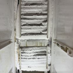 Seniors Electrical and Appliance Repair - Clogged evaporator coil due to defective heating element and wire harness assembly.