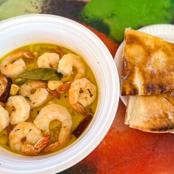 Paella & Tapas - a bowl of soup and a plate of pita chips - Spanish Near Me - New Port Richey, Florida Paella & Tapas - a bowl of soup and a plate of pita chips - Spanish Near Me - New Port Richey, Florida