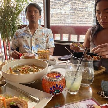 Kubo - MacArthur enjoying Longganisa Burger with Fries and Madison enjoying Sizzling beef shank - Filipino Near Me - Chicago, Illinois Kubo - MacArthur enjoying Longganisa Burger with Fries and Madison enjoying Sizzling beef shank - Filipino Near Me - Chicago, Illinois
