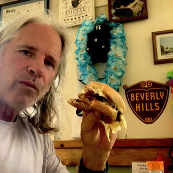 Country Gals Cafe - a man eating a sandwich - American Near Me - Cambridge, New York