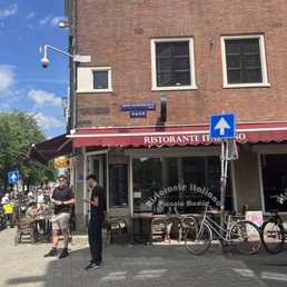 Limited outdoor seating on quieter streets corner.