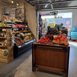 Kenny's Iga South - More produce and water cases in the background