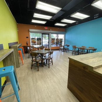 Piñones En Orlando - a restaurant with tables and chairs - Latin American Near Me - Orlando, Florida Piñones En Orlando - a restaurant with tables and chairs - Latin American Near Me - Orlando, Florida