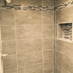 Grossman's Bargain Outlet - The $1 grey porcelain tile, and $9 backsplash tile installed (by our contractor) in our shower